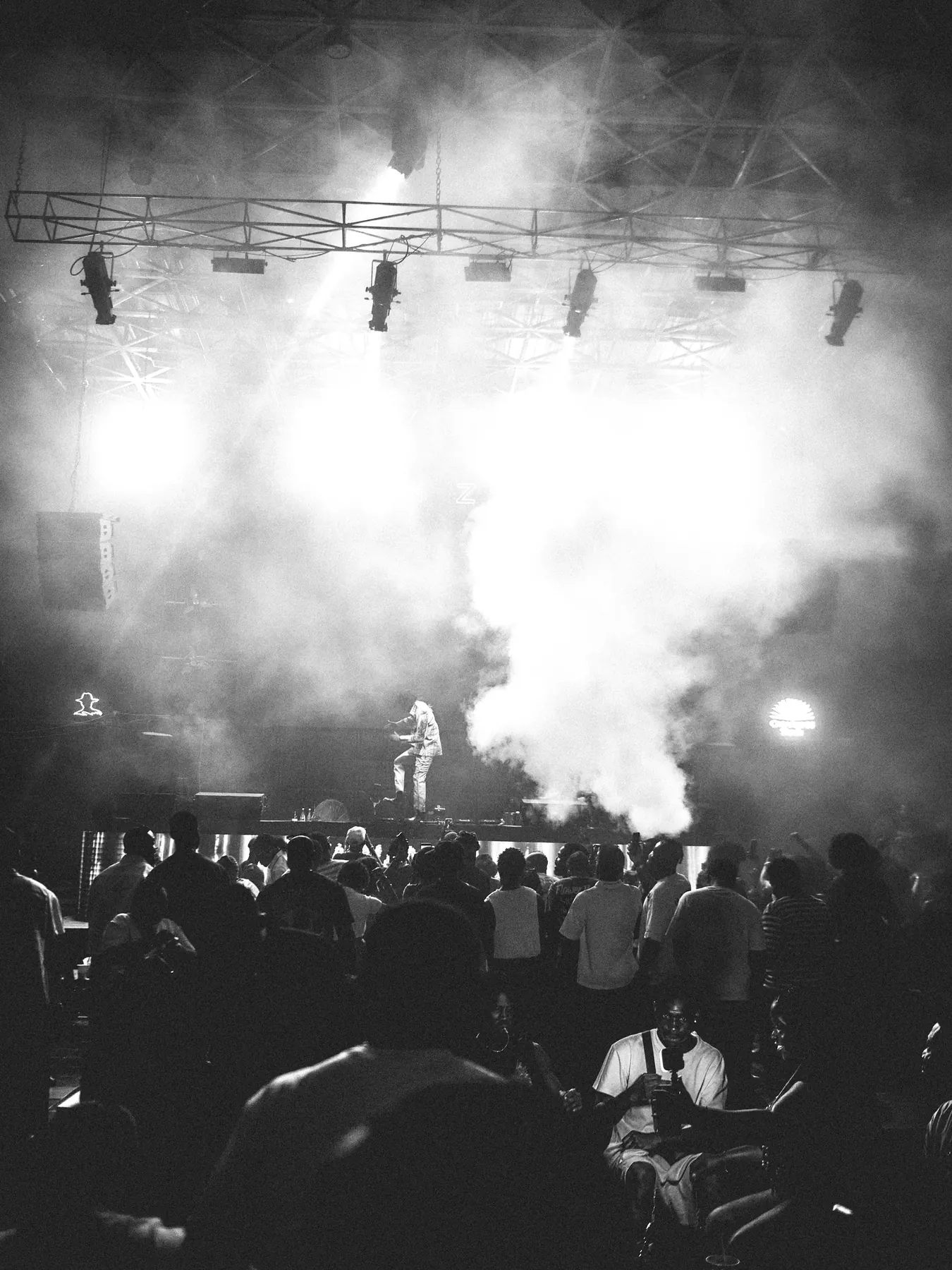 A stage in smoke, black and white